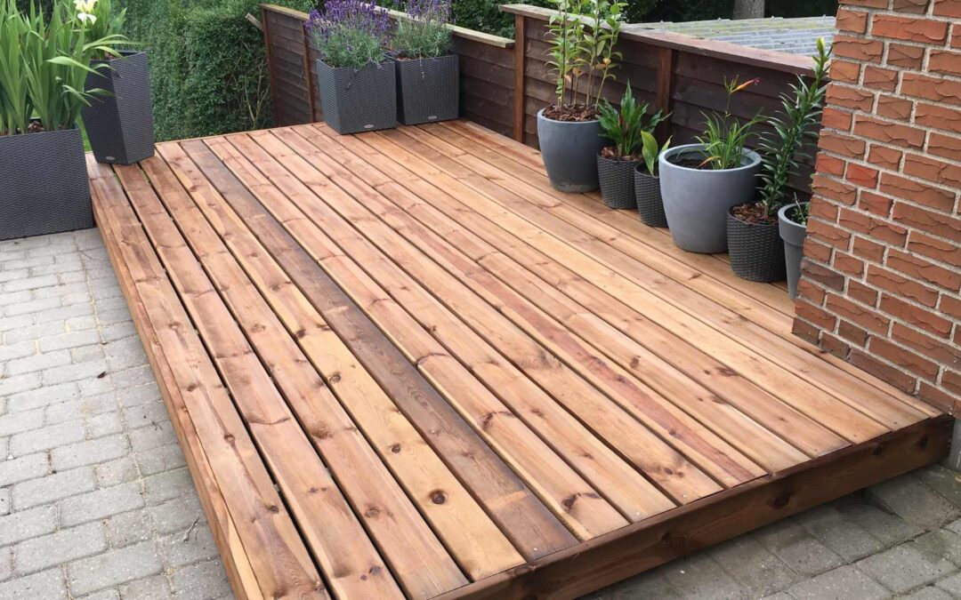 Réaliser une terrasse en bois sur sol meuble.